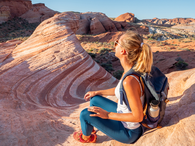 Woman looking at rock formation at Valley of Fire State Park