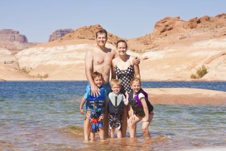 Family on a fun summer vacation at the lake